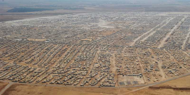An aerial view shows the Zaatari refugee camp on July 18, 2013 near the Jordanian city of Mafraq, some 8 kilometers from the Jordanian-Syrian border. The northern Jordanian Zaatari refugee camp is home to 115,000 Syrians. AFP PHOTO/MANDEL NGAN/POOL